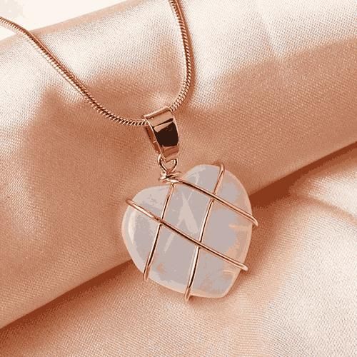 Heart-Shaped Crystal Stone Pendant with Elegant Metal Wrap